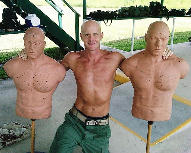 This undated photograph obtained by The Seattle Times shows FBI Special Agent Frederick W. Humphries posing with target dummies following a SWAT practice in an unknown location. The Times says Humphries sent the photograph to friend and Florida socialite Jill Kelley and others, including one of the paper's own reporters, in an email Sept. 9, 2010. (AP Photo/Special to The Seattle Times) This undated photograph obtained by The Seattle Times shows FBI Special Agent Frederick W. Humphries posing with target dummies following a SWAT practice in an unknown location. The Times says Humphries sent the photograph to friend and Florida socialite Jill Kelley and others, including one of the paper's own reporters, in an email Sept. 9, 2010. (AP Photo/Special to The Seattle Times)